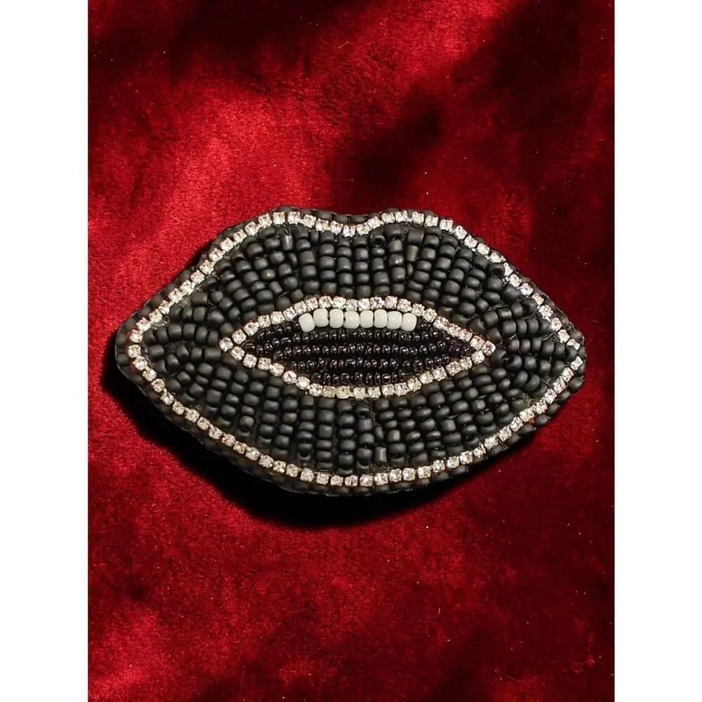 Designer's Murka Matte Black Beaded Lip Brooch with Crystal Accent